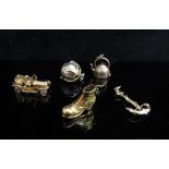 Four 9ct gold charms including Masonic, boot, car and one other (5), 16.