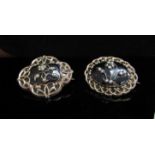 Two Victorian gold, black enamelled mourning brooches with seed pearl set flower motifs,