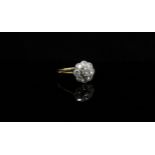 A gold diamond daisy ring, stamped 18ct/plat. Size R, 2.
