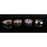 Four 9ct gold rings including sapphire and garnet set examples, 11.