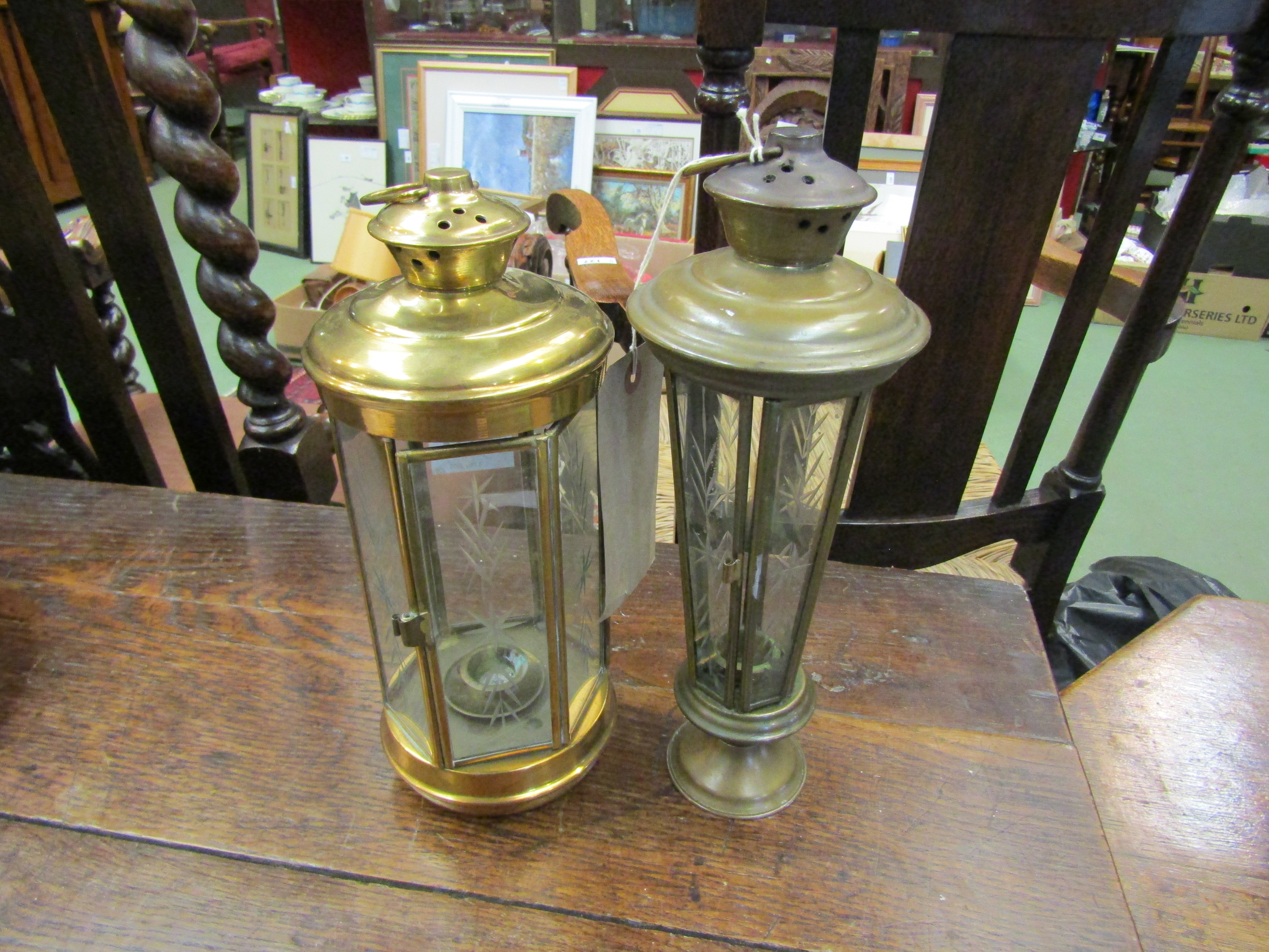 Two brass effect candle lamps with cut glass panels