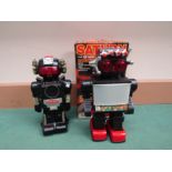 Two 1980's battery powered plastic robots to include "Magic Mike II" and boxed "Saturn the 13"