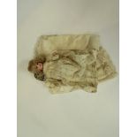 A Victorian bisque headed doll's house doll