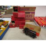 A Hornby 0 gauge clockwork tinplate 0-4-0 locomotive together with nine boxed items of rolling