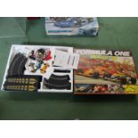 A boxed Scalextric Formula 1 Silverstone slot racing set with one additional car