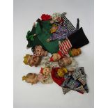 A collection of assorted vintage Punch & Judy glove puppets including carved wooden and composition