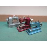 Three Vulcan child's sewing machines