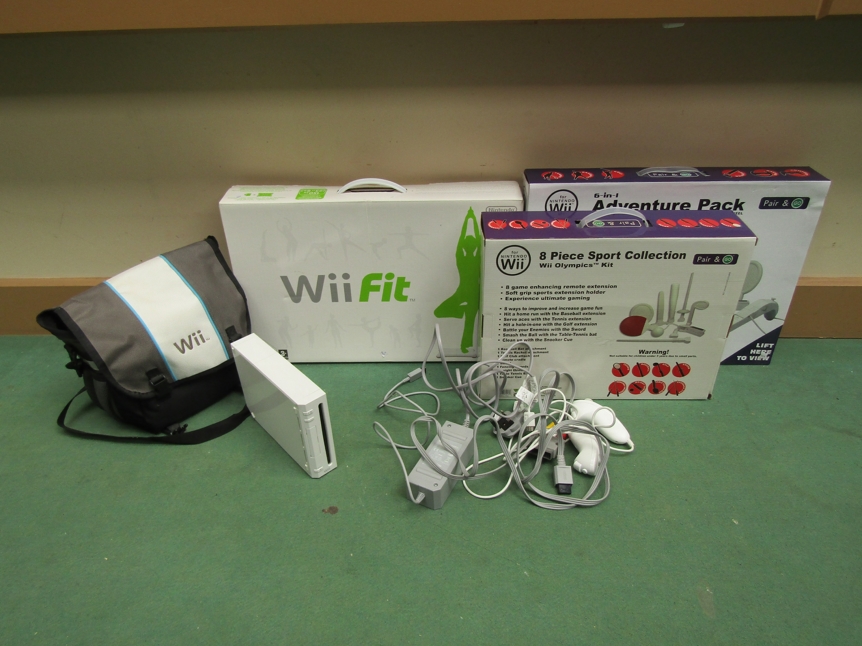 A Nintendo Wii computer games console in carry case with various games including Super Mario Bros.