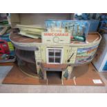 A Triang Minic garage and a tinplate toy