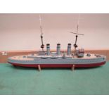 A hand built wooden model of WWI German cruiser ship, on stand,