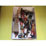 A small collection of painted wooden articulated dolls and one compostion example