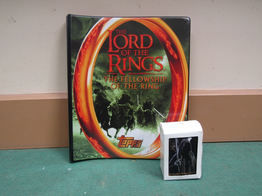 A box of Topps The Lord Of The Rings trading cards and folder