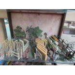 A collection of Britains lead scenic items including trees, flint wall, fallen tree, fences,