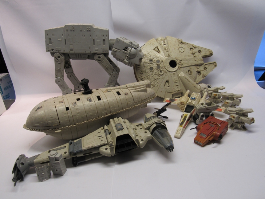 A collection of Kenner Star Wars vehicles including At-At, Rebel Transport, Millenium Falcon,