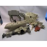 A collection of Kenner Star Wars vehicles including At-At, Rebel Transport, Millenium Falcon,