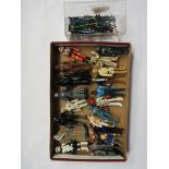 Twenty one loose vintage Star Wars figures and a collection of weapons and accessories