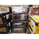 Two boxed Maisto Special Edition 1:18 scale diecast Mercedes-Benz and two Burago examples (4)