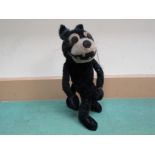 An early 20th Century Felix the Cat straw filled black and white mohair poseable figure,