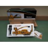 A boxed TWH 1:50 scale diecast Vermeer TG7000 Tub Grinder with Loader and Peterbilt Model 379