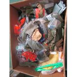 A box of vintage Action Man clothing and accessories