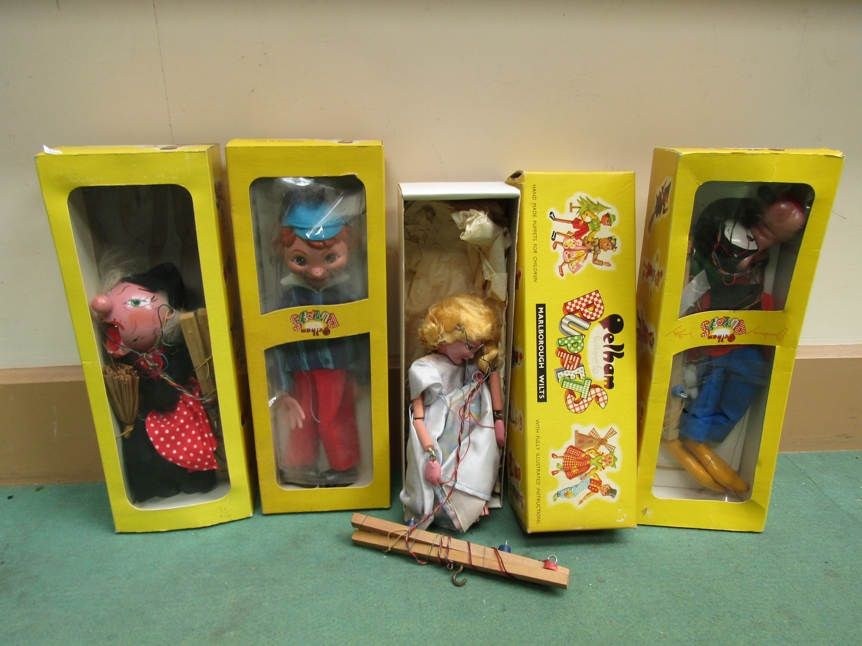 Four boxed Pelham Puppets; SL14 Goofy, SL Cinderella,