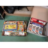 Two boxes containing a collection of vintage board games,