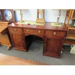 A 19th Century mahogany twin pedestal desk with modesty panel,
