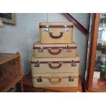A set of three "Watajoy" suitcases and one other