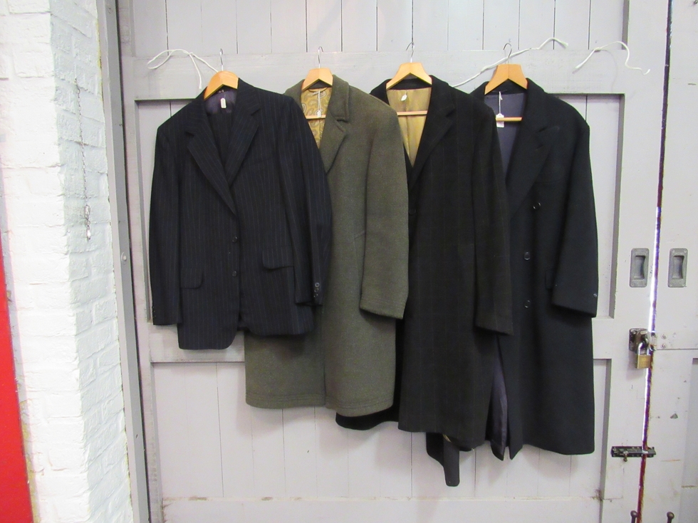 A collection of men's clothing to include wool double breasted coats, waistcoats,