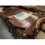 A Regency mahogany round cornered breakfast table on quatreform base with castors