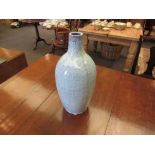 A pale blue textured vase,