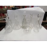 Eight glass decanters, some with matched stoppers, one with silver collar