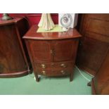 A George III flame mahogany bow front nightstand with satinwood line inlay, the two door cupboard