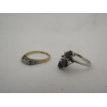 A gold and diamond ring and another marked 325
