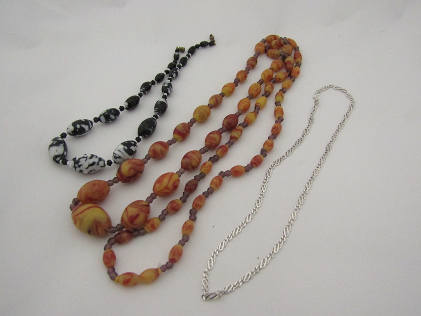 An Italian silver necklace marked 925 and two glass bead necklaces