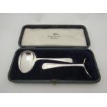 A cased Walker & Hall silver christening set comprising of spoon and pusher