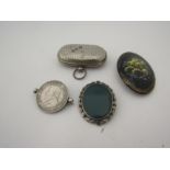 A plated double sovereign case, three brooches including coin example