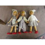 Three Polish wooden dolls