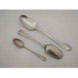 Two silver spoons and one other