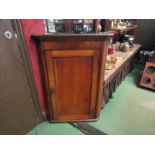 A 19th Century mahogany corner cupboard with key, 97cm tall x 69cm wide