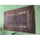 A wool prayer rug on dark ground with multiple Geometric borders 145cm x 96cm