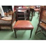 A pair of rosewood dining chairs with leather seats, bar backs on turned front legs