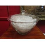 A glass punch bowl set with cups