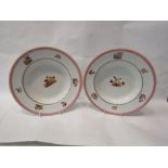 A pair of plated depicting mythical creatures