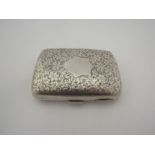 A silver cigarette case with foliate detail and blank cartouche, dented, 100g, Birmingham 1900