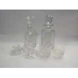 A Stuart Crystal decanter with stopper and two matching tumblers, a Thomas Webb decanter with