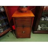 A 19th Century mahogany nightstand the tambour front top over a single base drawer on castors with