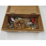 A box of bijouterie, mainly brooches