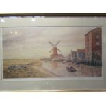 A framed and glazed limited edition print of river and windmill scene by M Bensley, signed and