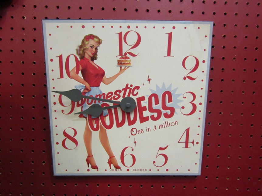 A Jones Clocks 'Domestic Goddess' square wall clock, 25cm diameter